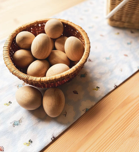 Wooden eggs in basket
