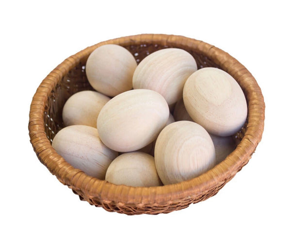 Wooden eggs in basket